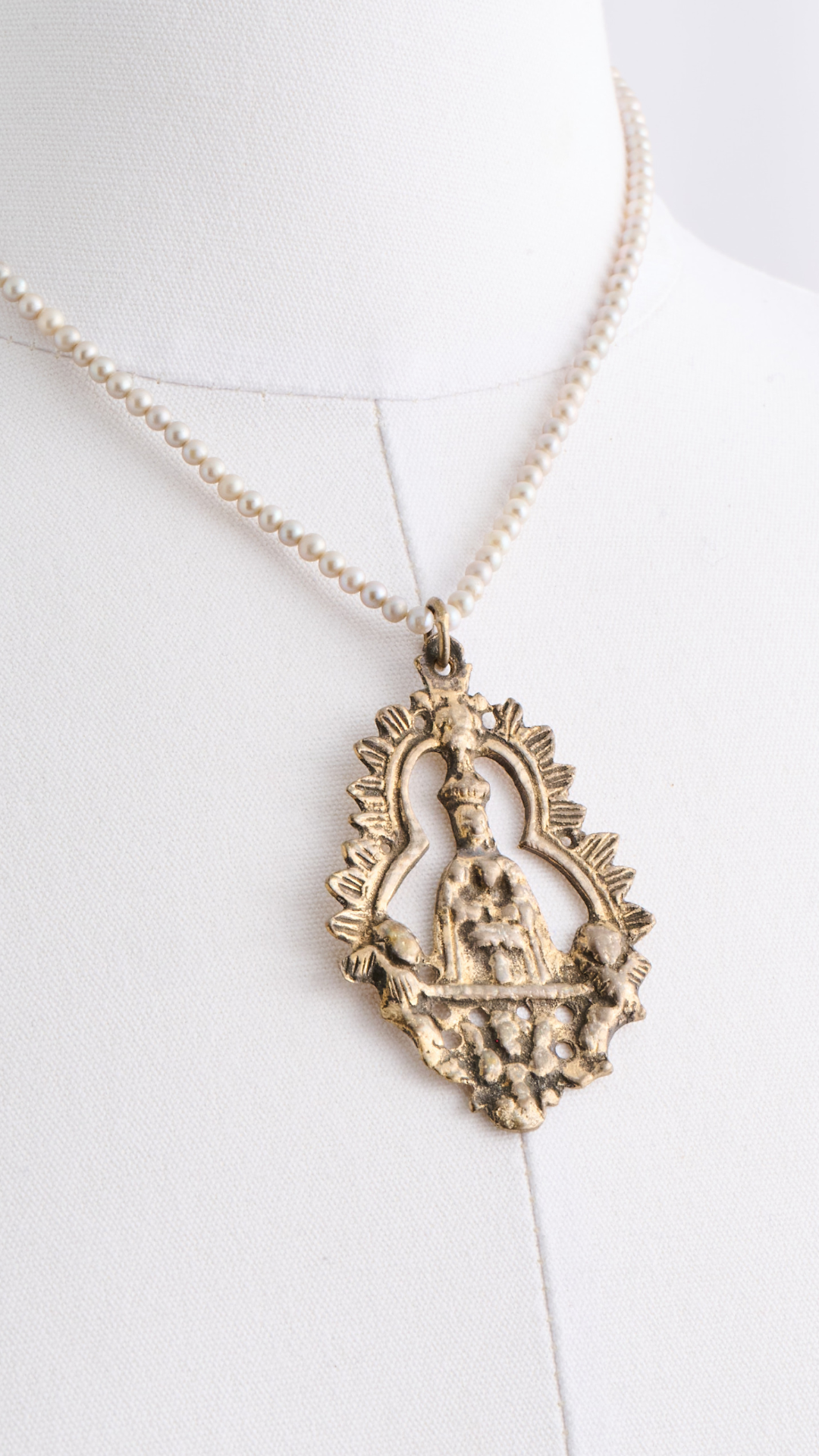 Antique Bronze Pendant on Pearls