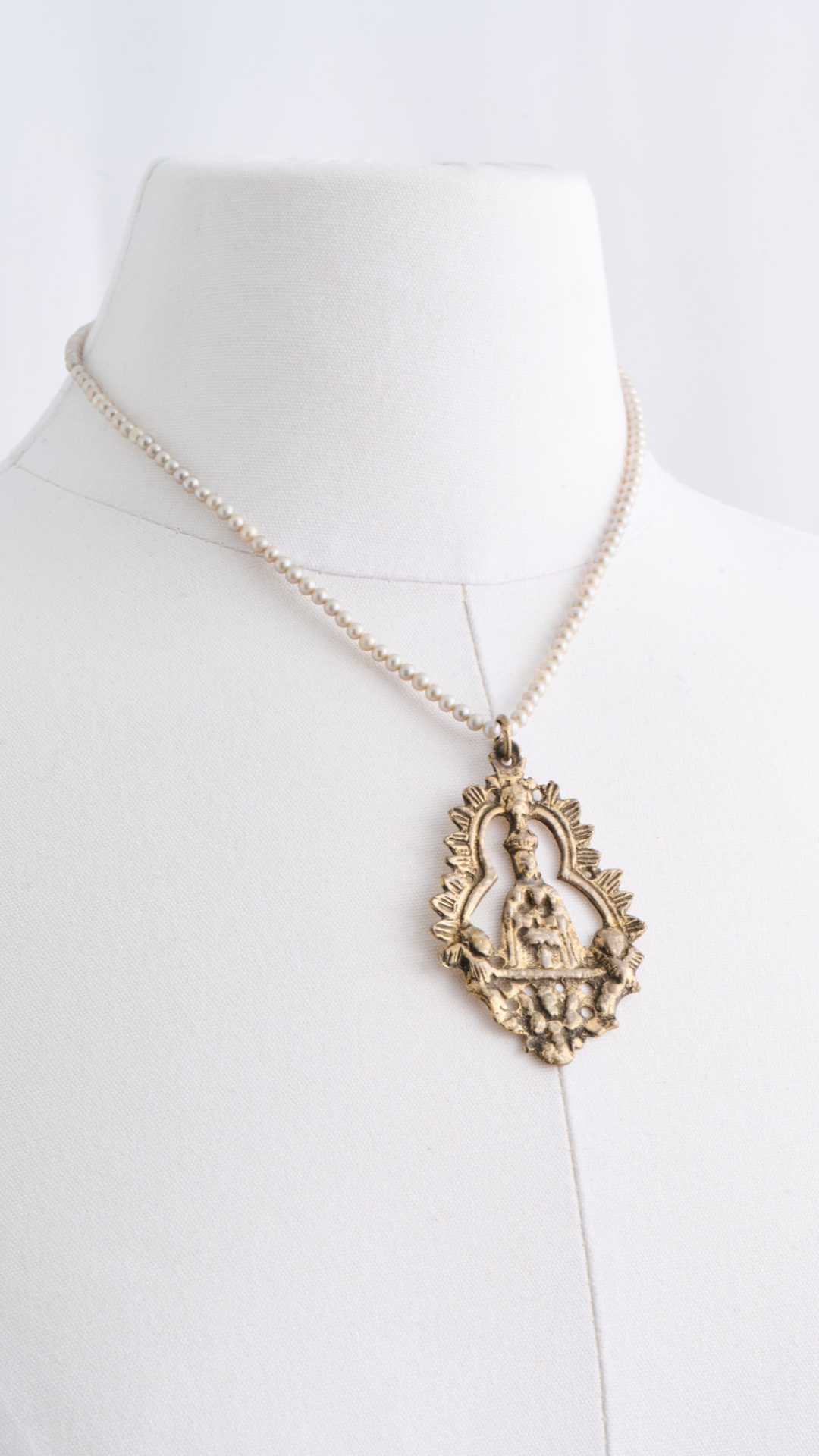 Antique Bronze Pendant on Pearls